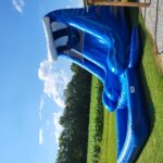 Blue Marble Water Slide – A thrilling inflatable slide rental perfect for summer fun in Raleigh, Clayton, and surrounding areas.